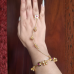 Aura Floral Ghungroo Hand Harness Hathphool – Gold Plated with Ruby Stone Aura Floral Ghungroo Hand Harness Hathphool – Gold Plated with Ruby Stone